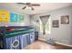 Bright bedroom featuring a loft bed, wood floors, and Star Wars decor at 4409 Woodward Mill Rd, Sugar Hill, GA 30518
