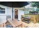 Cozy wooden deck with dining table and outdoor access to the backyard at 4409 Woodward Mill Rd, Sugar Hill, GA 30518