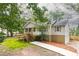 This home offers a charming exterior with tidy landscaping and a convenient garage at 4409 Woodward Mill Rd, Sugar Hill, GA 30518