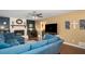 Spacious living room featuring a fireplace, ceiling fan, and hardwood floors at 4409 Woodward Mill Rd, Sugar Hill, GA 30518