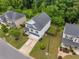 Aerial shot of the two-story home, landscaped yard, driveway, and neighborhood at 197 Cherokee Reserve Cir, Canton, GA 30115