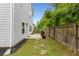 Fenced backyard with a concrete patio and grass at 197 Cherokee Reserve Cir, Canton, GA 30115