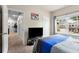 Bright bedroom with a large window and view of the neighboring house at 197 Cherokee Reserve Cir, Canton, GA 30115