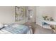 Bedroom with a white desk and bed, with a large cactus art piece at 197 Cherokee Reserve Cir, Canton, GA 30115