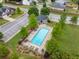 A community pool area with ample seating and green trees surrounding a fenced-in area at 197 Cherokee Reserve Cir, Canton, GA 30115