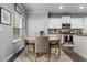 Charming dining area featuring a round table, upholstered chairs, and a window with natural light at 197 Cherokee Reserve Cir, Canton, GA 30115