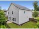 Two-story home with a patio, siding, windows, black mulch and wooden fence surrounding a grassy backyard at 197 Cherokee Reserve Cir, Canton, GA 30115