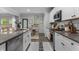 Open kitchen featuring stainless steel appliances, granite counters, and an adjacent dining area at 197 Cherokee Reserve Cir, Canton, GA 30115