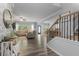 Inviting entry with staircase and a view to the open living room and dining area at 197 Cherokee Reserve Cir, Canton, GA 30115