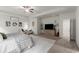 Bright main bedroom with a ceiling fan, TV and sitting area, and large carpet at 197 Cherokee Reserve Cir, Canton, GA 30115