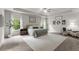 Spacious main bedroom with a tray ceiling, plush carpeting, and ample natural light at 197 Cherokee Reserve Cir, Canton, GA 30115