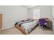 Cozy bedroom featuring carpet, neutral walls, and a window for natural light at 2545 Gatewater Ct, Cumming, GA 30040