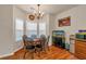 Bright dining room with hardwood floors, chandelier, and a view from the large windows at 2545 Gatewater Ct, Cumming, GA 30040