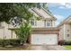 Charming two-story home featuring a brick-accented garage and well-maintained landscaping at 2545 Gatewater Ct, Cumming, GA 30040
