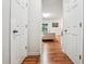 Inviting hallway with hardwood floors leading to a sunlit living area at 2545 Gatewater Ct, Cumming, GA 30040