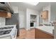 Functional kitchen with essential appliances and convenient laundry area at 2545 Gatewater Ct, Cumming, GA 30040