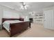 Large main bedroom with carpeted floors, multiple windows, ceiling fans, and ample space at 2545 Gatewater Ct, Cumming, GA 30040
