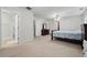 Large main bedroom featuring an en-suite bathroom, walk-in closet, and comfortable bed at 2545 Gatewater Ct, Cumming, GA 30040