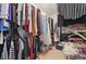 Organized walk-in closet with hanging rods, shelves, and ample storage space for clothing and personal belongings at 2545 Gatewater Ct, Cumming, GA 30040