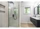 Modern bathroom featuring a glass shower with tiled walls and contemporary vanity at 2975 Rollingwood Se Ln, Atlanta, GA 30316