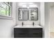 Contemporary bathroom with a double sink vanity and modern lighting at 2975 Rollingwood Se Ln, Atlanta, GA 30316