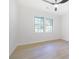 Bright bedroom with a ceiling fan, two windows, and neutral walls at 2975 Rollingwood Se Ln, Atlanta, GA 30316