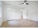 Bedroom with new wood flooring, two windows, ceiling fan and a closet at 2975 Rollingwood Se Ln, Atlanta, GA 30316