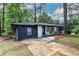 Charming single-story home featuring a paved driveway, well-maintained lawn, and inviting entrance at 2975 Rollingwood Se Ln, Atlanta, GA 30316