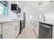 Modern kitchen with stainless steel appliances, white cabinetry, and quartz countertops at 2975 Rollingwood Se Ln, Atlanta, GA 30316