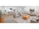 Inviting open-concept living room with modern furniture and decor flowing into a bright, modern kitchen at 2975 Rollingwood Se Ln, Atlanta, GA 30316