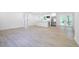 Open living space featuring new floors, white walls, and view into the modern kitchen at 2975 Rollingwood Se Ln, Atlanta, GA 30316