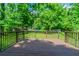 Spacious wooden deck perfect for outdoor entertaining and relaxation with an green lawn beyond at 4567 Parkway Cir, Atlanta, GA 30349