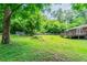 Lush backyard view with a deck overlooking a grassy area, providing a serene outdoor space at 4567 Parkway Cir, Atlanta, GA 30349