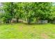 Expansive backyard with mature trees offers plenty of privacy and a natural setting at 4567 Parkway Cir, Atlanta, GA 30349