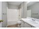 Bright bathroom featuring a combined shower and tub, a single vanity, and neutral decor at 4567 Parkway Cir, Atlanta, GA 30349