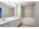 Bathroom featuring dual sinks, large soaking tub, and modern fixtures for a relaxing retreat at 4567 Parkway Cir, Atlanta, GA 30349