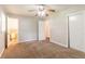 Bedroom featuring neutral walls, plush carpeting, closet, and access to a bathroom at 4567 Parkway Cir, Atlanta, GA 30349