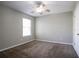 Serene bedroom featuring a ceiling fan and a window, providing plenty of natural light at 4567 Parkway Cir, Atlanta, GA 30349