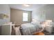 Comfortable bedroom with soft lighting, a cozy bed, and tasteful decor, ideal for a peaceful night's sleep at 4567 Parkway Cir, Atlanta, GA 30349