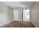Comfortable carpeted bedroom with two doors, offering plenty of natural light and space at 4567 Parkway Cir, Atlanta, GA 30349