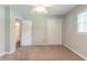 Bedroom featuring neutral walls, plush carpeting, closet, and a ceiling fan at 4567 Parkway Cir, Atlanta, GA 30349
