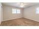A bright bedroom features a ceiling fan and two windows to allow for natural light at 4567 Parkway Cir, Atlanta, GA 30349