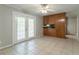 Cozy dining area with tile flooring, French doors, and built-in shelving and cabinetry at 4567 Parkway Cir, Atlanta, GA 30349