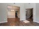 Dining room featuring hardwood floors, neutral walls, updated lighting and staircase to upper floor at 4567 Parkway Cir, Atlanta, GA 30349