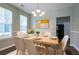 Elegant dining area featuring a stylish table setting, modern chandelier, and contemporary decor for sophisticated meals at 4567 Parkway Cir, Atlanta, GA 30349