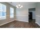 Dining room featuring hardwood floors, neutral walls, updated lighting and views to the exterior at 4567 Parkway Cir, Atlanta, GA 30349