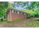 The house shows an exterior brick facade with white trim windows and simple landscaping at 4567 Parkway Cir, Atlanta, GA 30349