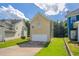 Two-story home featuring a well-manicured lawn and attached garage at 4567 Parkway Cir, Atlanta, GA 30349