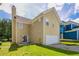 Two-story home featuring a well-manicured lawn and attached garage at 4567 Parkway Cir, Atlanta, GA 30349
