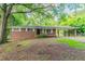 Charming brick ranch-style home featuring a covered carport and well-maintained landscaping at 4567 Parkway Cir, Atlanta, GA 30349